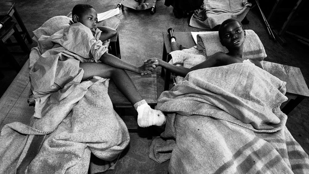 Two-young-boys-who-had-limbs-cut-off-with-machetes-comfort-each-other-in-a-hospital-in-Kigali-...jpg